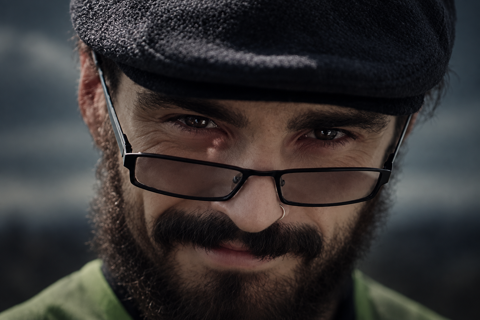 The artist from Death's Visage looking over his glasses